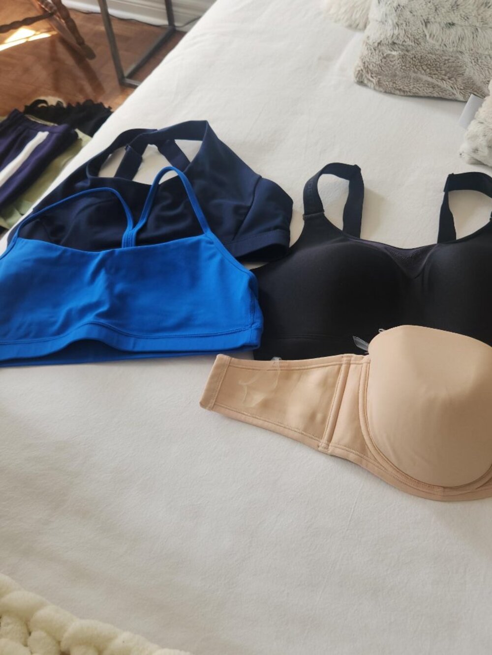 4 Bras. Two NWT size 36D and two large sports bras .